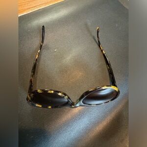 Almost brand new Calvin Klein shades. It has  frame and dark glassees